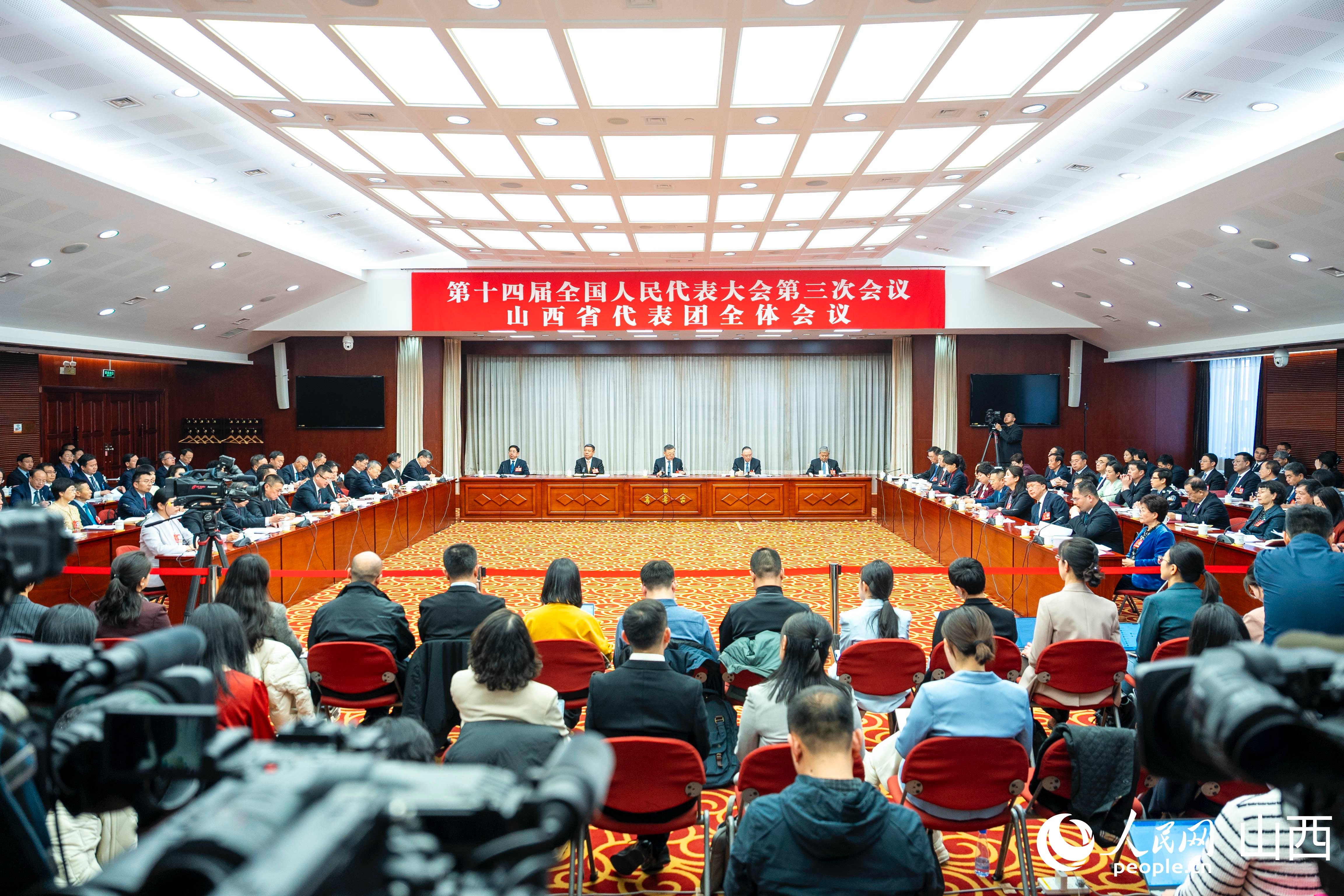 十四届全国人大三次会议山西代表团开放团组会议现场。